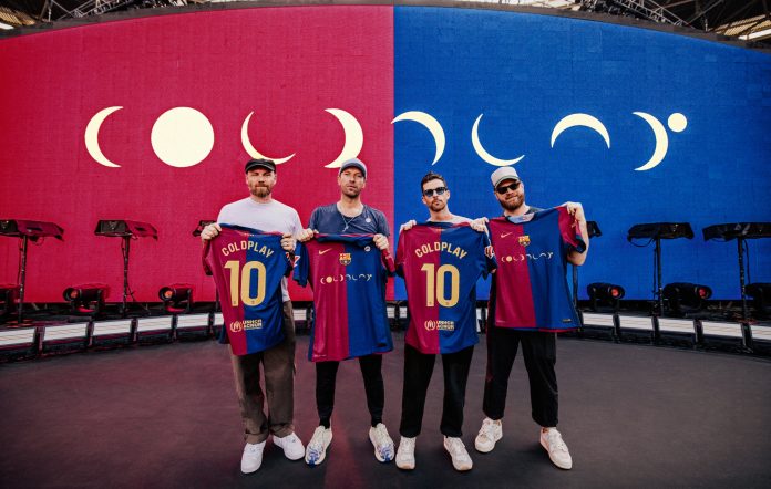 Coldplay wearing their Coldplay x Spotify x Barca shirt (Credit: Press)